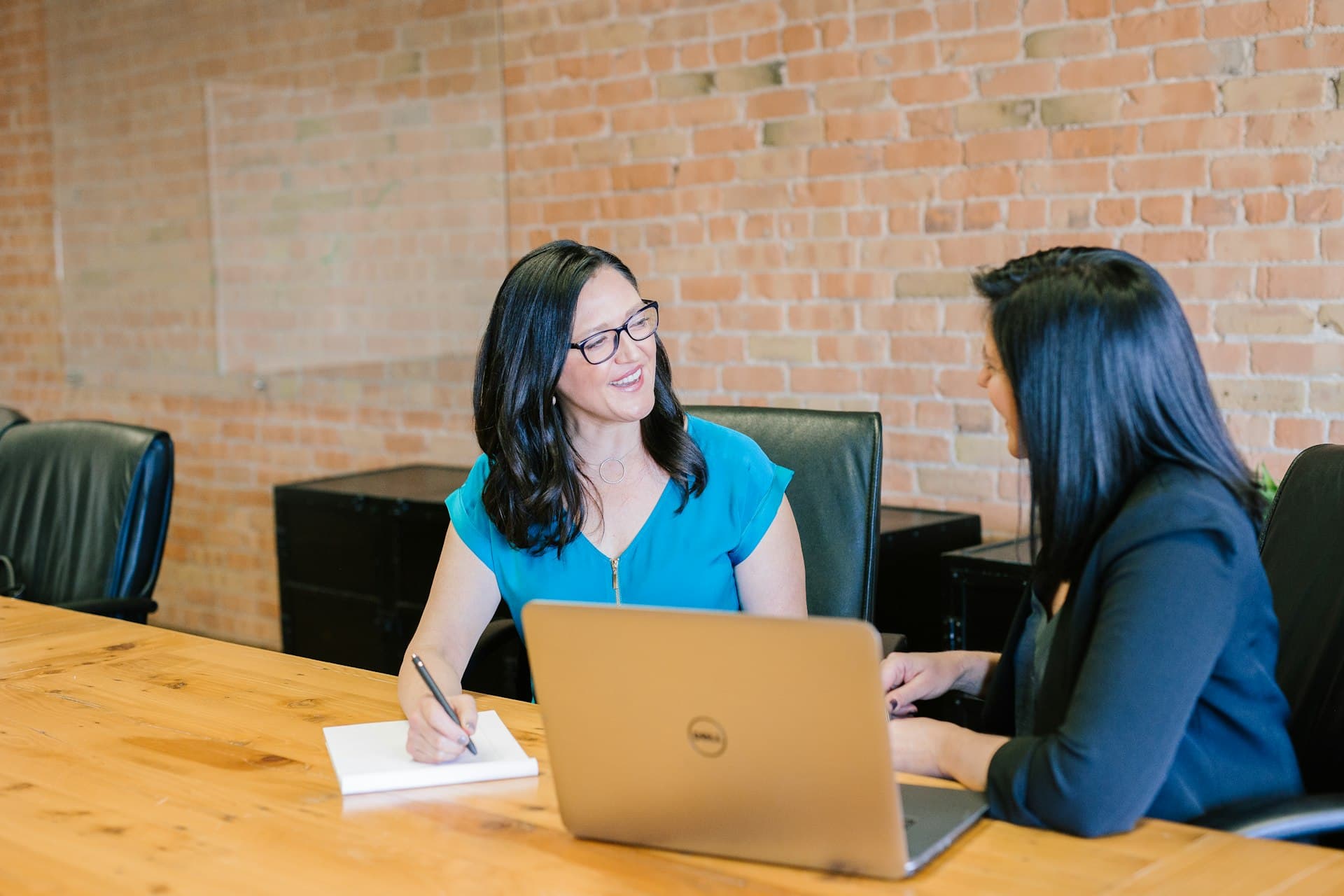 Two consultants reviewing Oracle Cloud access and controls together