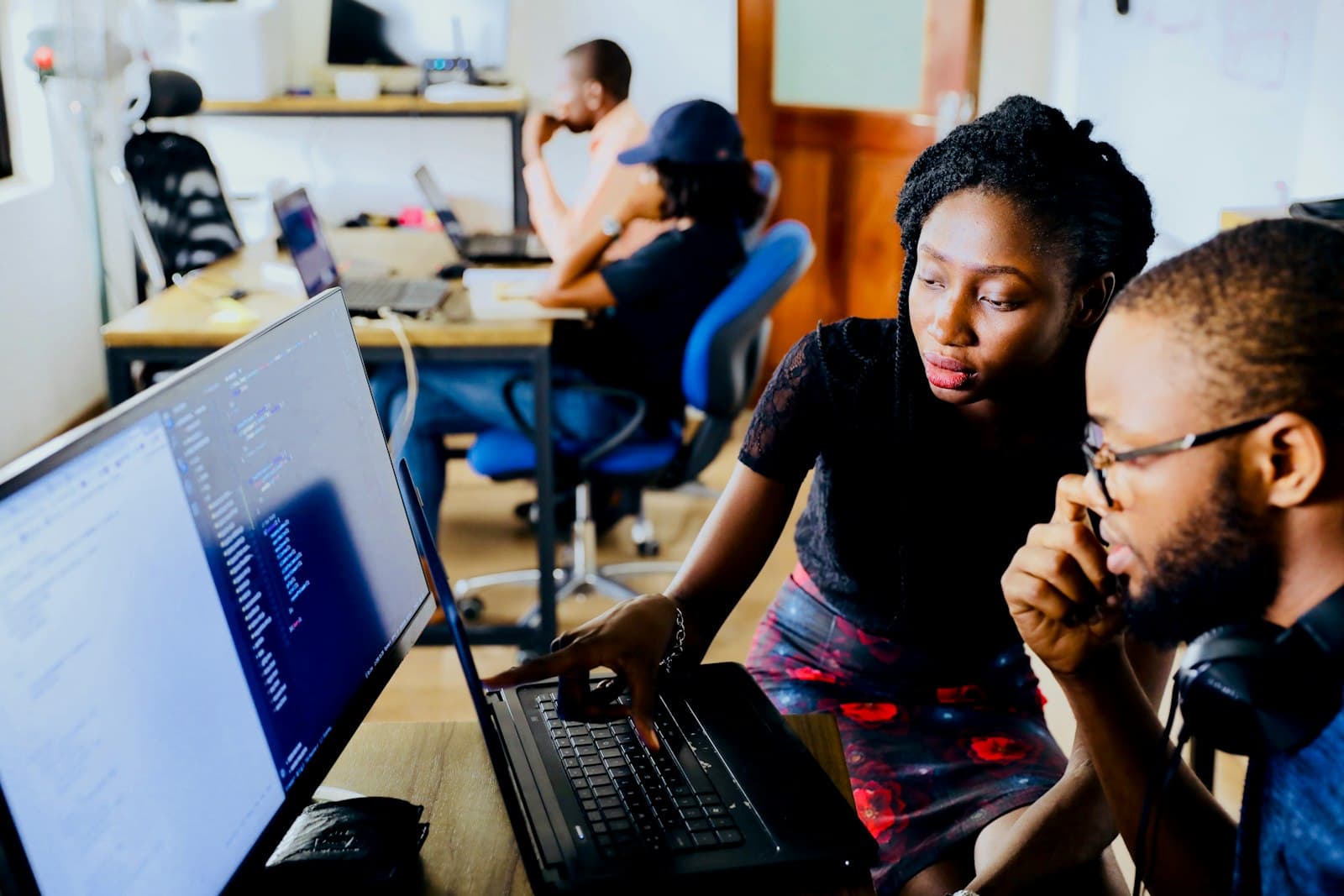 Consultants reworking Oracle role design at a screen